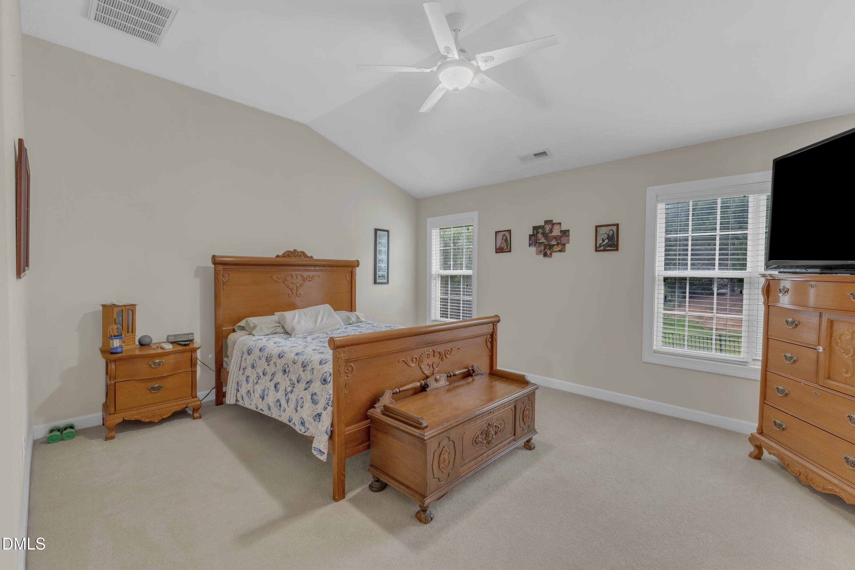 12227 Orchardgrass Lane Raleigh, NC 27614 - Photo 34 of 46 a bedroom with furniture and flat screen tv