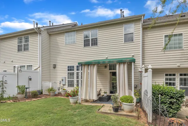 a front view of a house with a yard and porch