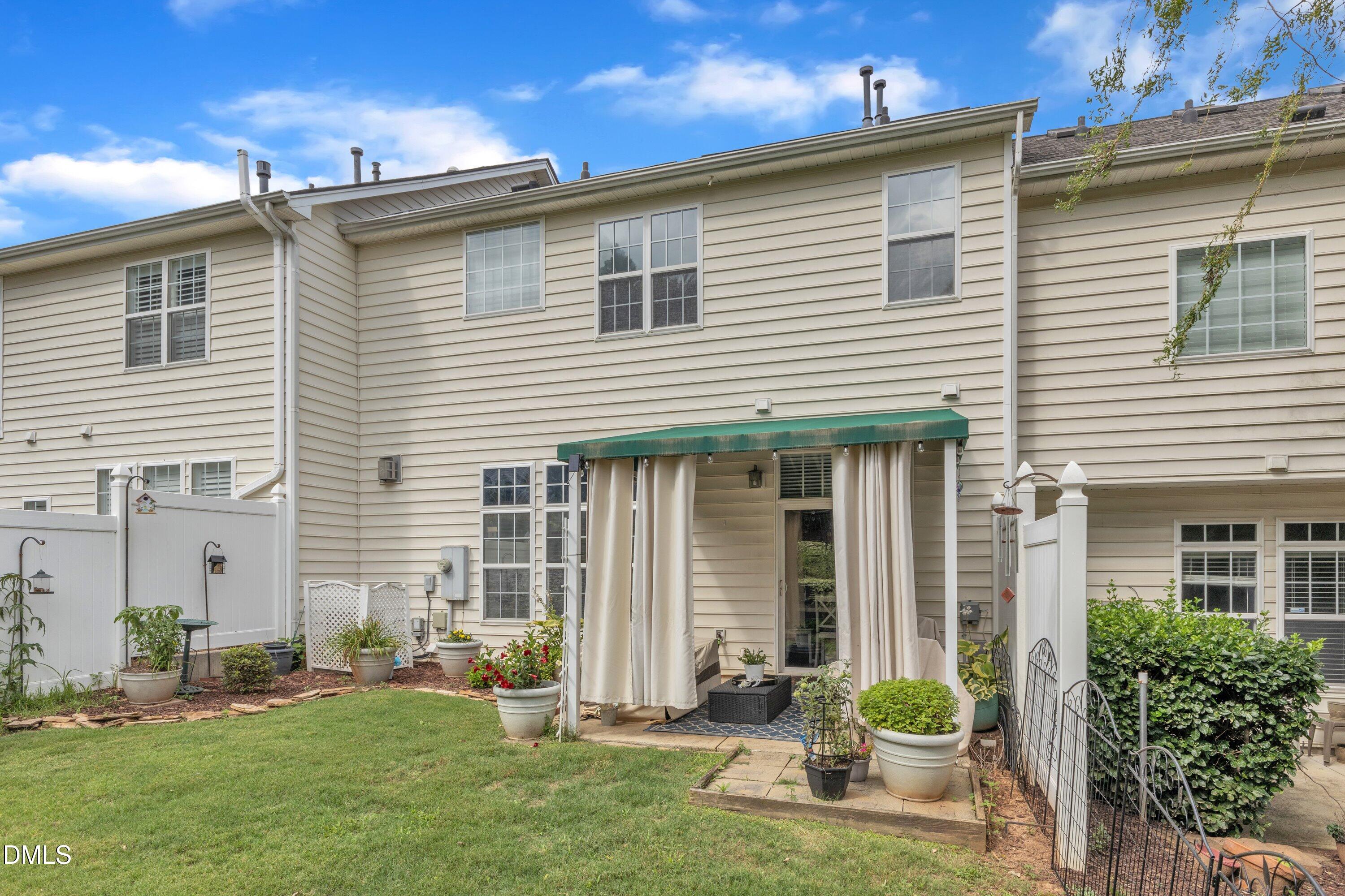 12227 Orchardgrass Lane Raleigh, NC 27614 - Photo 41 of 46 a front view of a house with a yard and garage