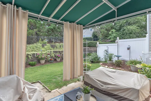 a view of a garage with a table and a chairs