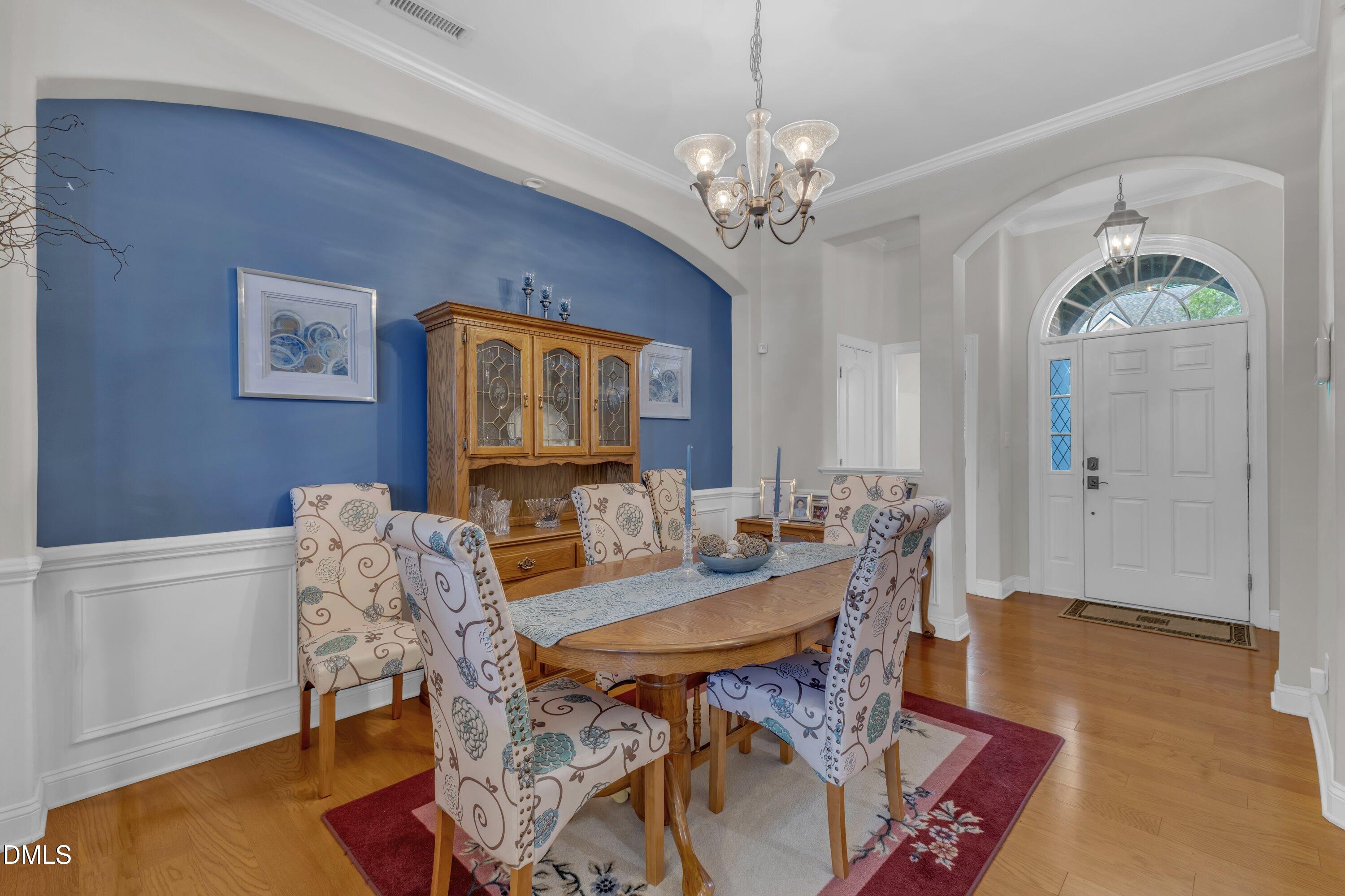 12227 Orchardgrass Lane Raleigh, NC 27614 - Photo 5 of 46 a view of a dining room with furniture and chandelier