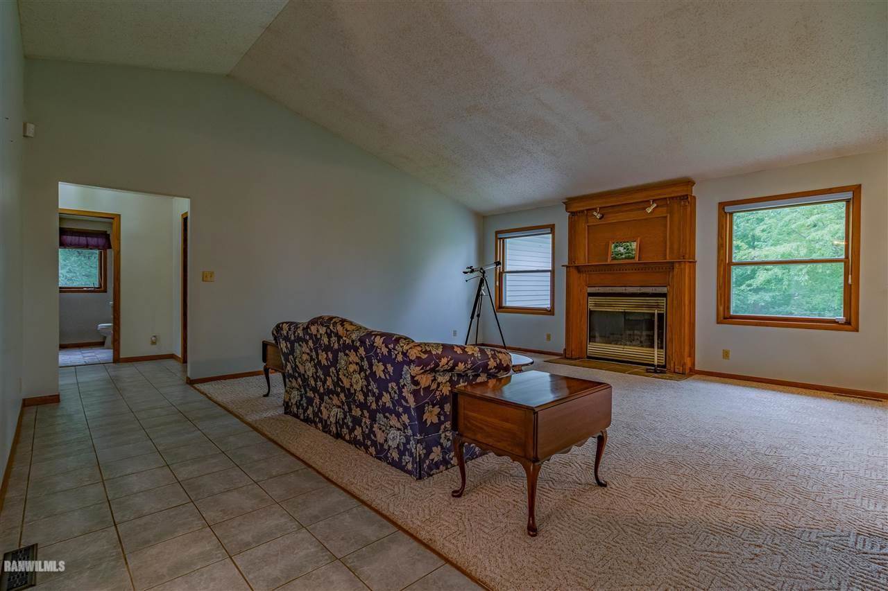 16867 Hartman Road Davis, IL 61019 - Photo 13 of 39 a living room with furniture and a fireplace