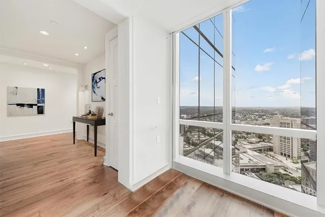 a view of an entryway with wooden floor