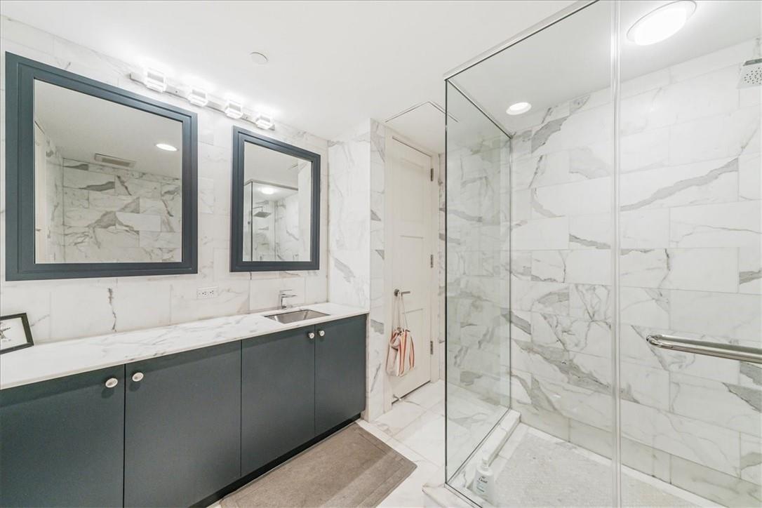 1 Renaissance Square, Unit PH2BC White Plains, NY 10601 - Photo 29 of 36 a bathroom with a double vanity sink mirror and double