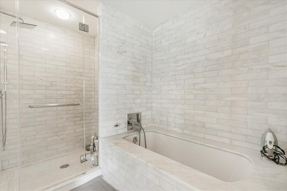 1 Renaissance Square, Unit PH2BC White Plains, NY 10601 - Photo 34 of 36 a bathroom with a bathtub and a shower