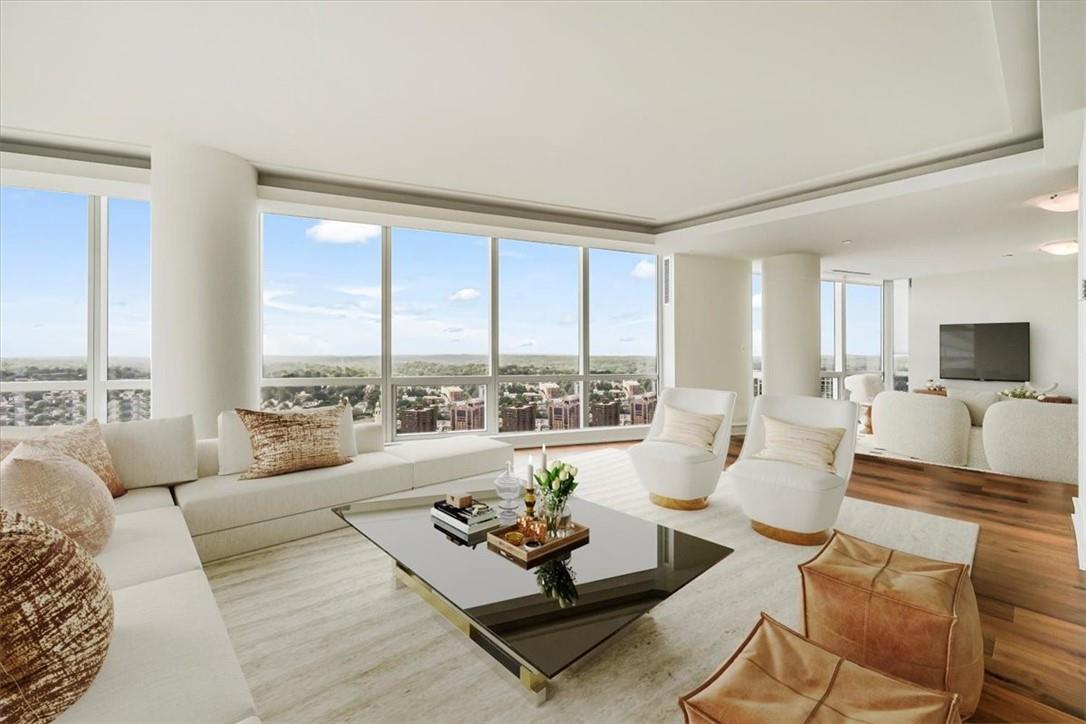1 Renaissance Square, Unit PH2BC White Plains, NY 10601 - Photo 6 of 36 a living room with furniture and a large window