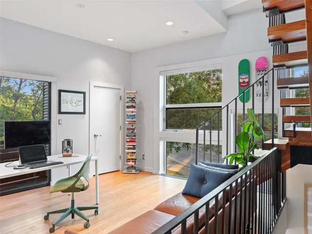 a view of a livingroom with furniture and a window