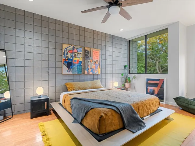 a bedroom with a bed and window