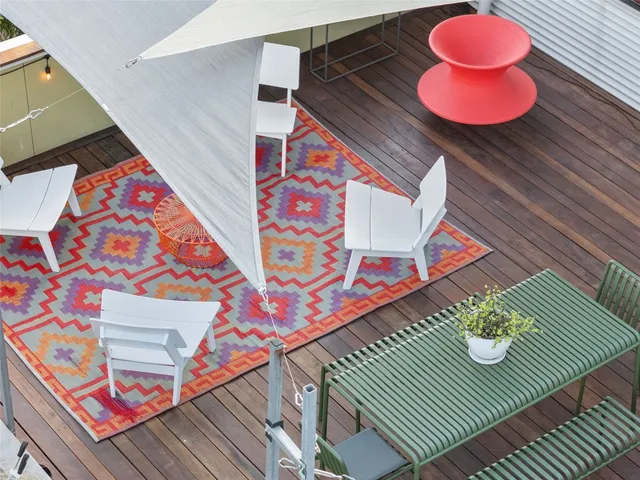 a aerial view of a house table and chairs