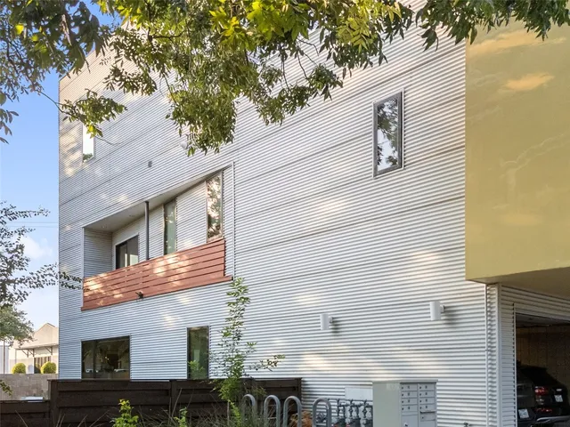 a backyard of a house with barbeque oven