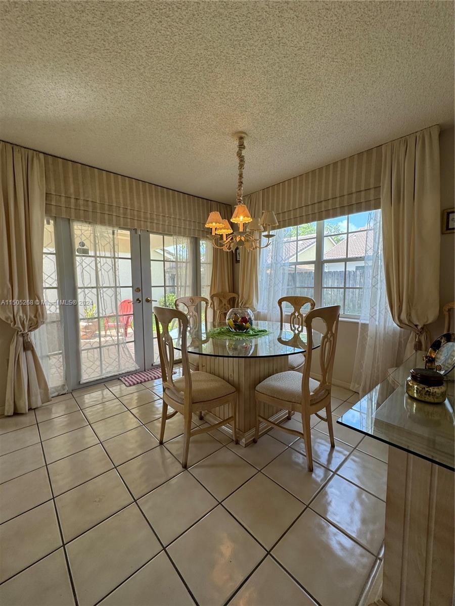 19232 Northwest 88th Place Hialeah, FL 33018 - Photo 13 of 61 a view of a dining room with furniture window and outside view