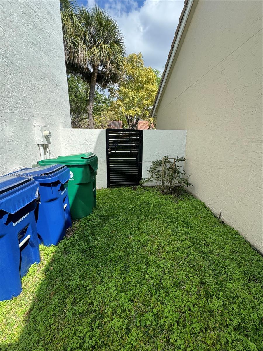 19232 Northwest 88th Place Hialeah, FL 33018 - Photo 14 of 61 a view of a backyard with plants