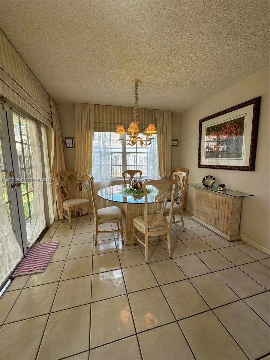 19232 Northwest 88th Place Hialeah, FL 33018 - Photo 17 of 61 a view of a dining room with furniture window and outside view