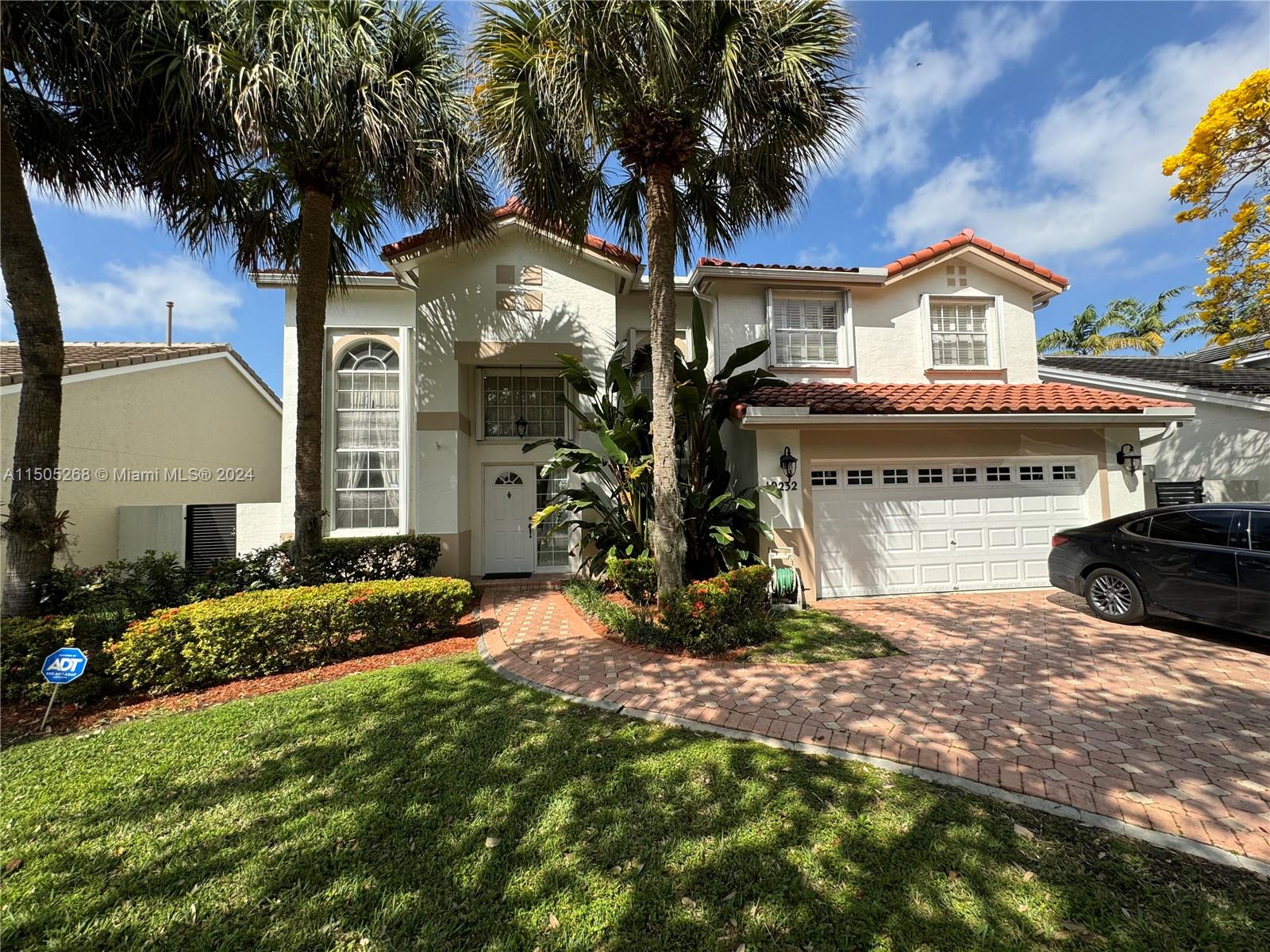 19232 Northwest 88th Place Hialeah, FL 33018 - Photo 2 of 61 a view of house with yard and entertaining space