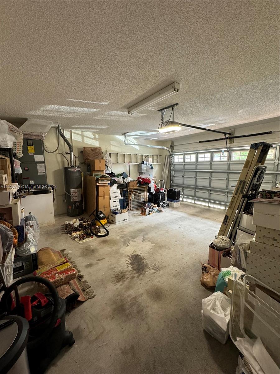 19232 Northwest 88th Place Hialeah, FL 33018 - Photo 27 of 61 a view of a room with gym equipment