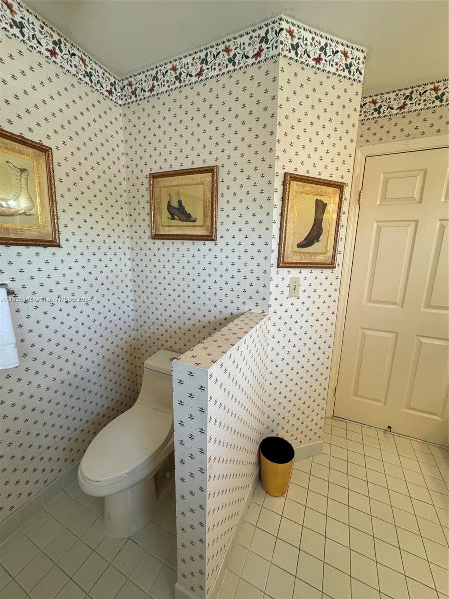 19232 Northwest 88th Place Hialeah, FL 33018 - Photo 37 of 61 a bathroom with a toilet and a shower