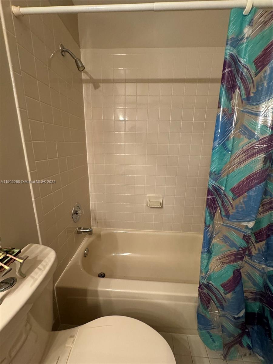 19232 Northwest 88th Place Hialeah, FL 33018 - Photo 43 of 61 a bathroom with a toilet and a shower