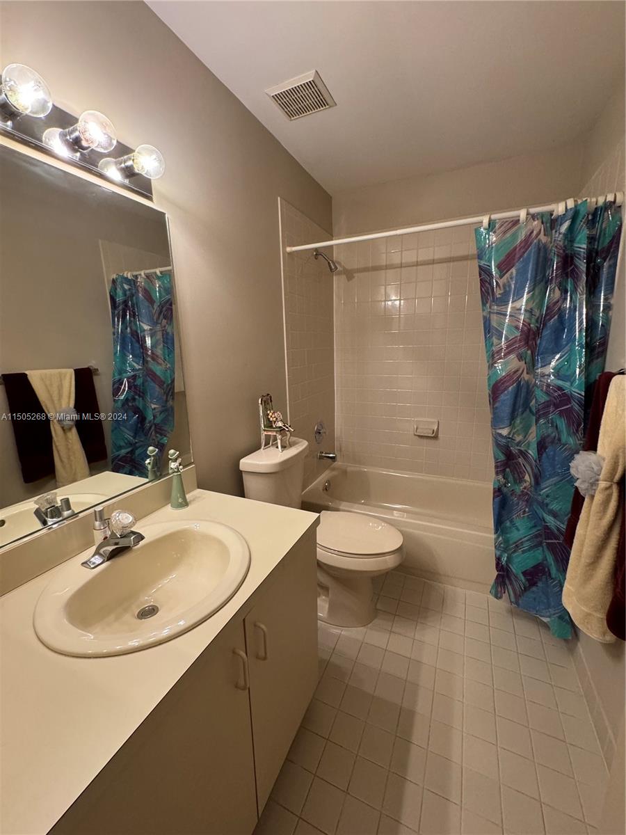 19232 Northwest 88th Place Hialeah, FL 33018 - Photo 44 of 61 a bathroom with a sink toilet and shower