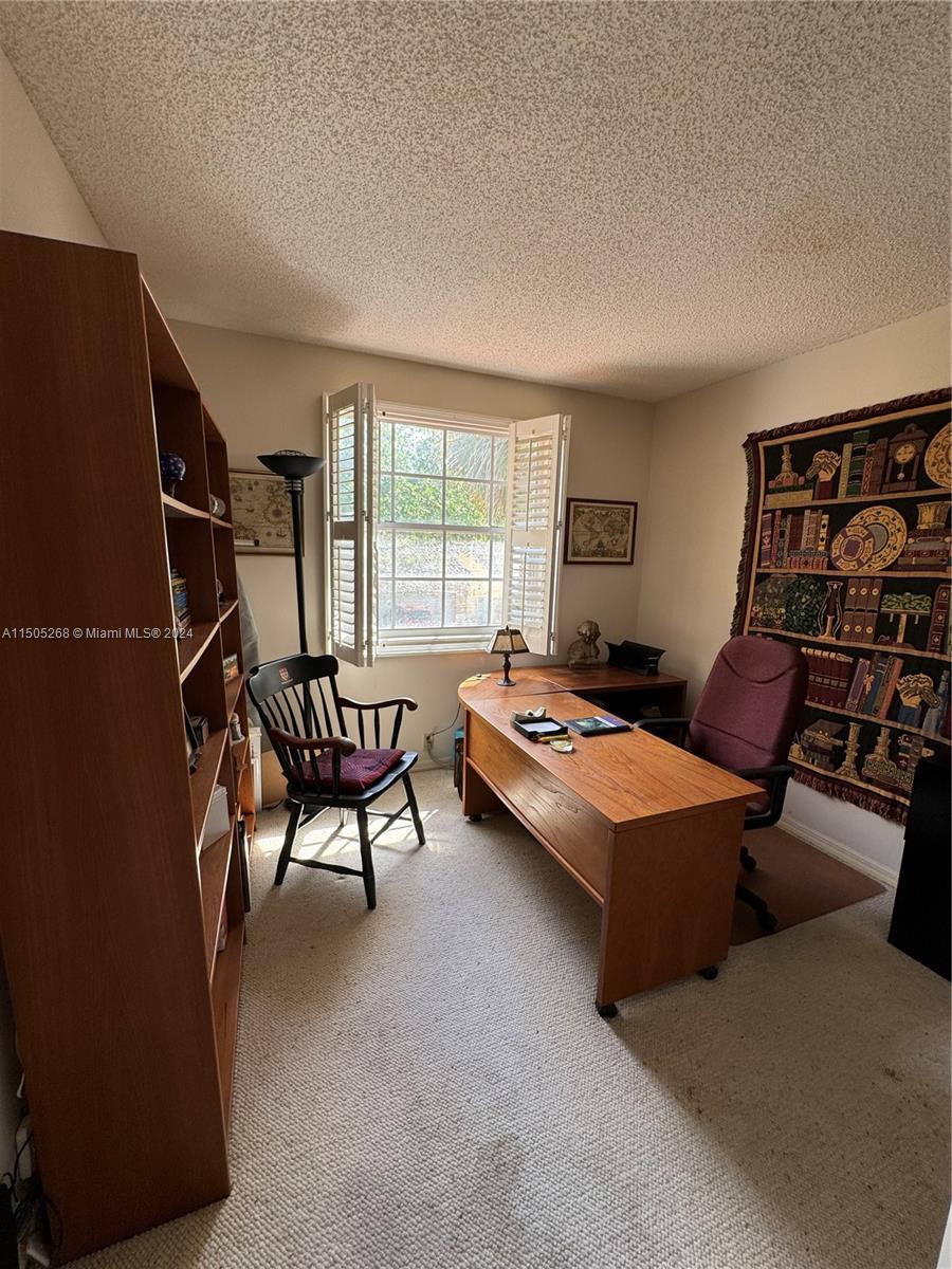 19232 Northwest 88th Place Hialeah, FL 33018 - Photo 46 of 61 a living room with furniture and a window