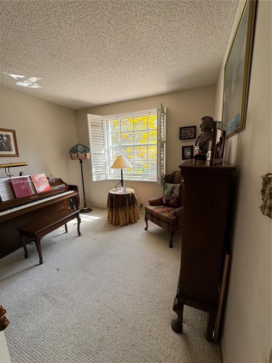 19232 Northwest 88th Place Hialeah, FL 33018 - Photo 47 of 61 a living room with furniture and a window