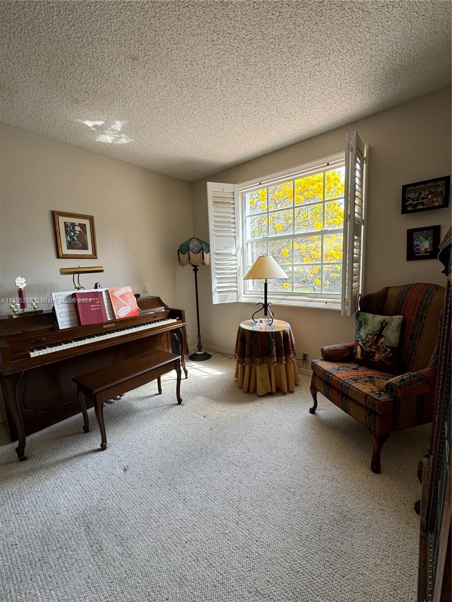 19232 Northwest 88th Place Hialeah, FL 33018 - Photo 49 of 61 a living room with furniture a pool table and a large window
