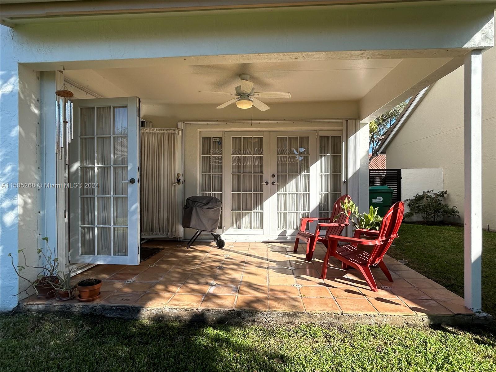 19232 Northwest 88th Place Hialeah, FL 33018 - Photo 52 of 61 a view of a house with backyard porch and sitting area