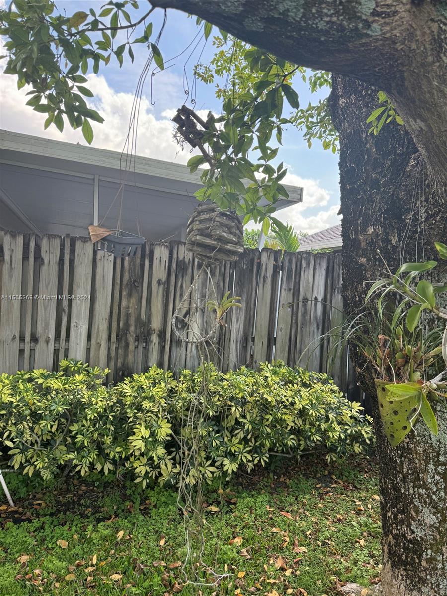 19232 Northwest 88th Place Hialeah, FL 33018 - Photo 55 of 61 a view of a garden with a flower in a garden