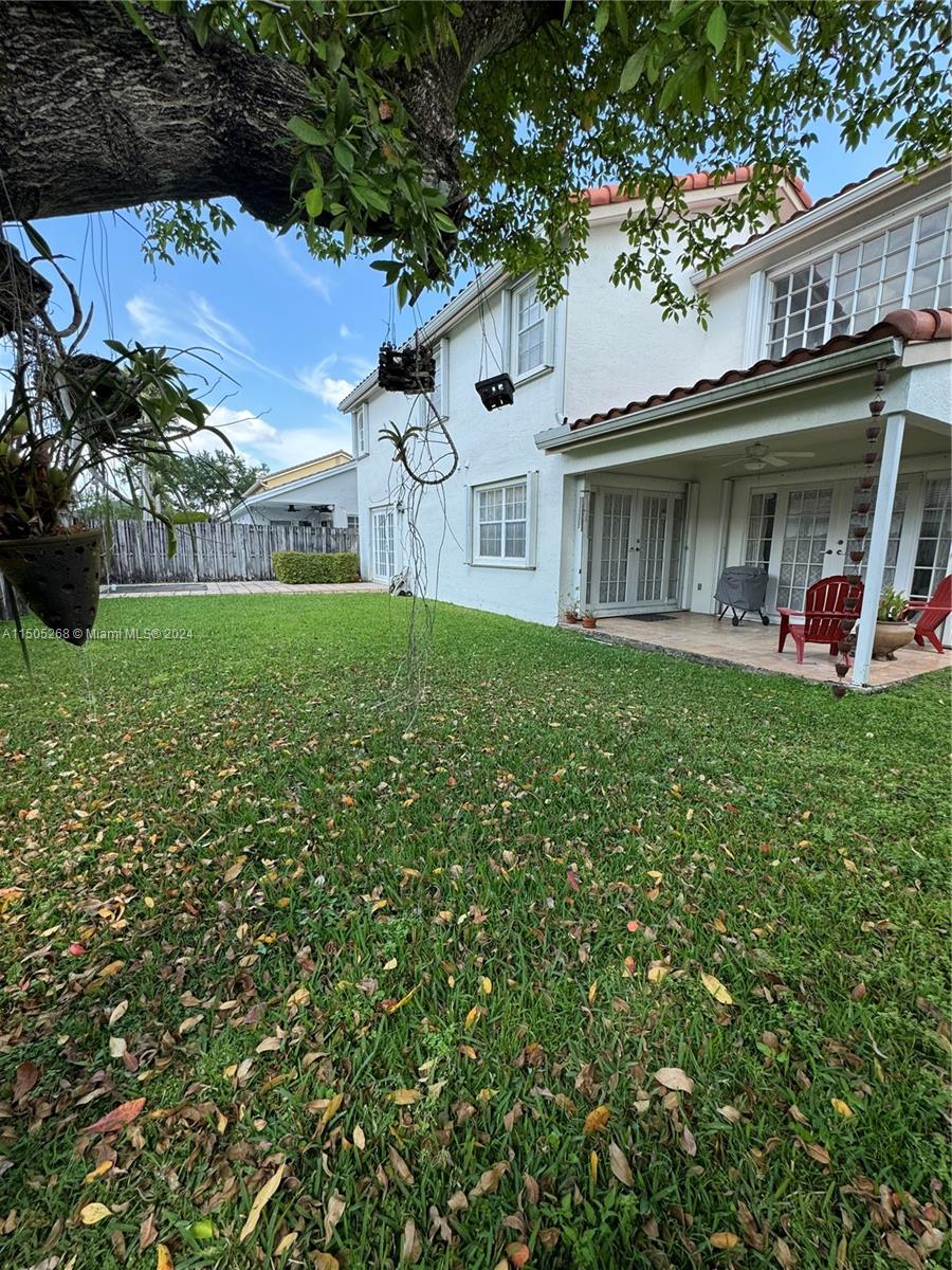 19232 Northwest 88th Place Hialeah, FL 33018 - Photo 56 of 61 a front view of a house with garden