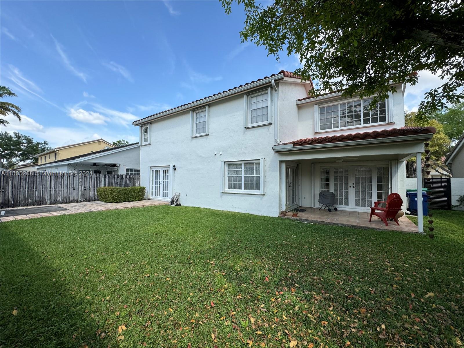 19232 Northwest 88th Place Hialeah, FL 33018 - Photo 59 of 61 a view of a house with a yard and sitting area