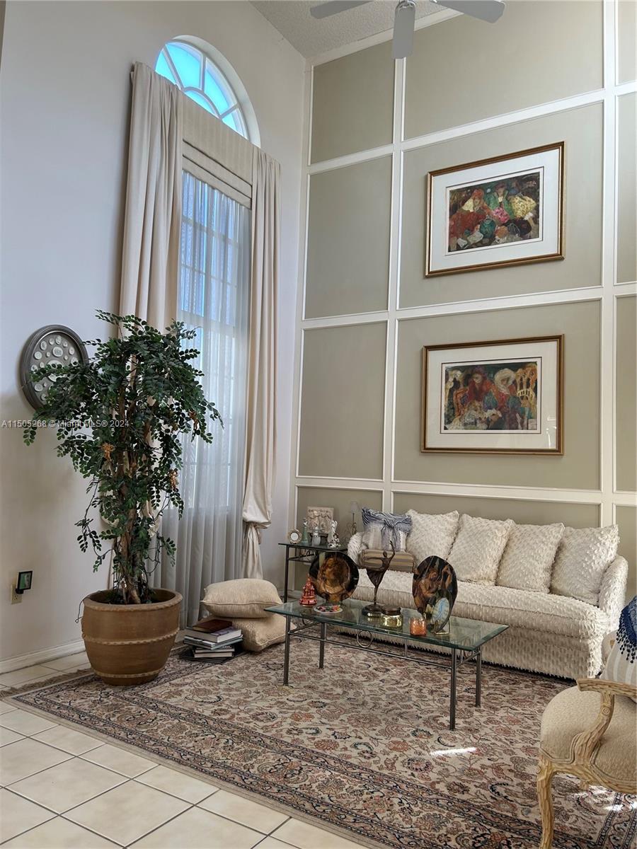 19232 Northwest 88th Place Hialeah, FL 33018 - Photo 9 of 61 a living room with furniture and a potted plant