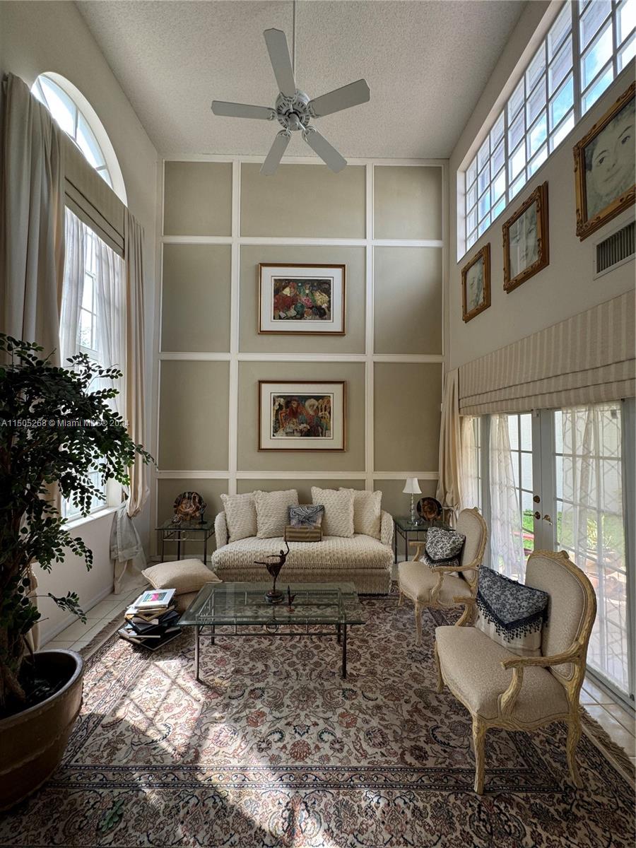 19232 Northwest 88th Place Hialeah, FL 33018 - Photo 10 of 61 a living room with furniture ceiling fan and a rug