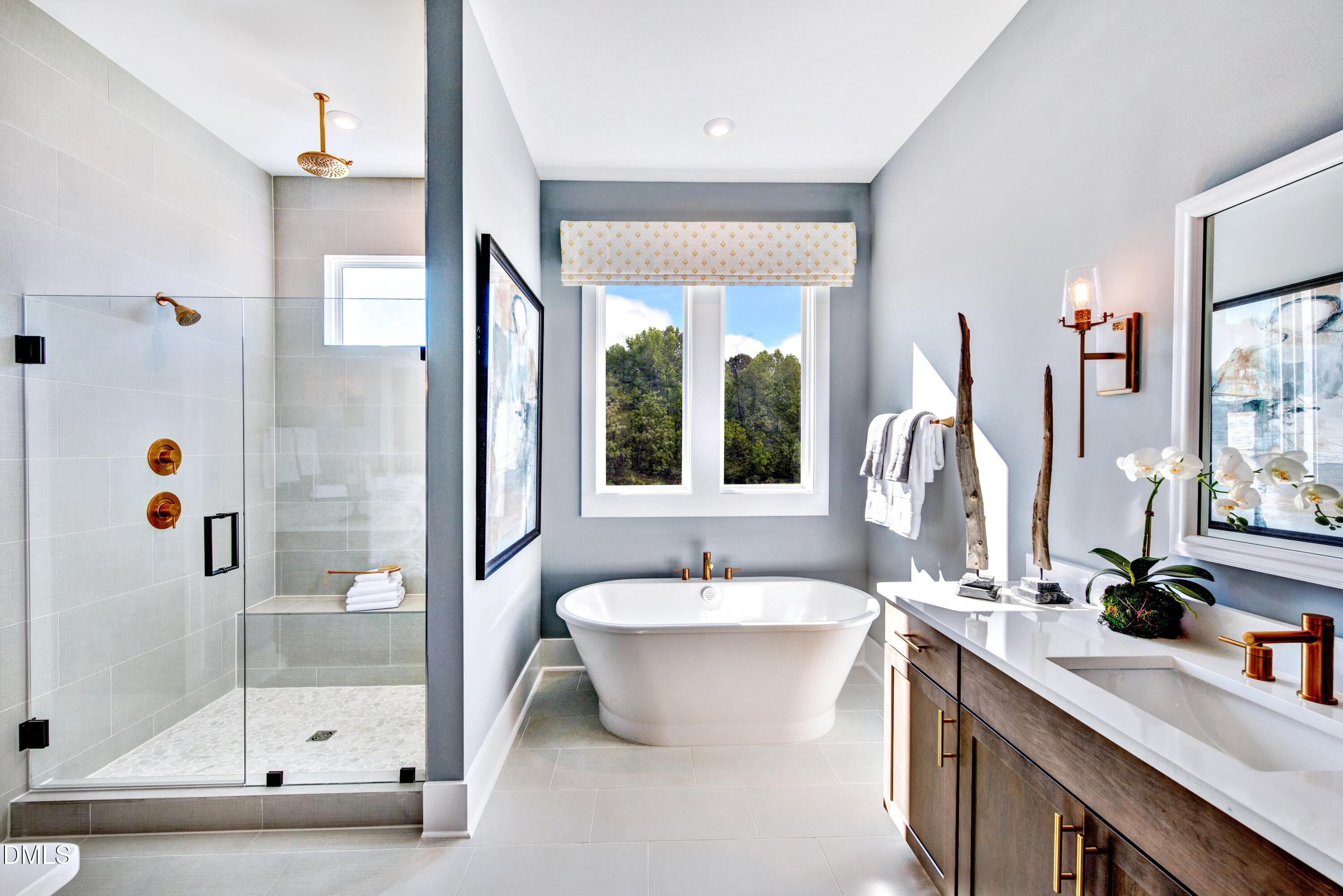 3 Wolf Tree Way Efland, NC 27243 - Photo 15 of 32 a bathroom with a double vanity sink a mirror and a shower