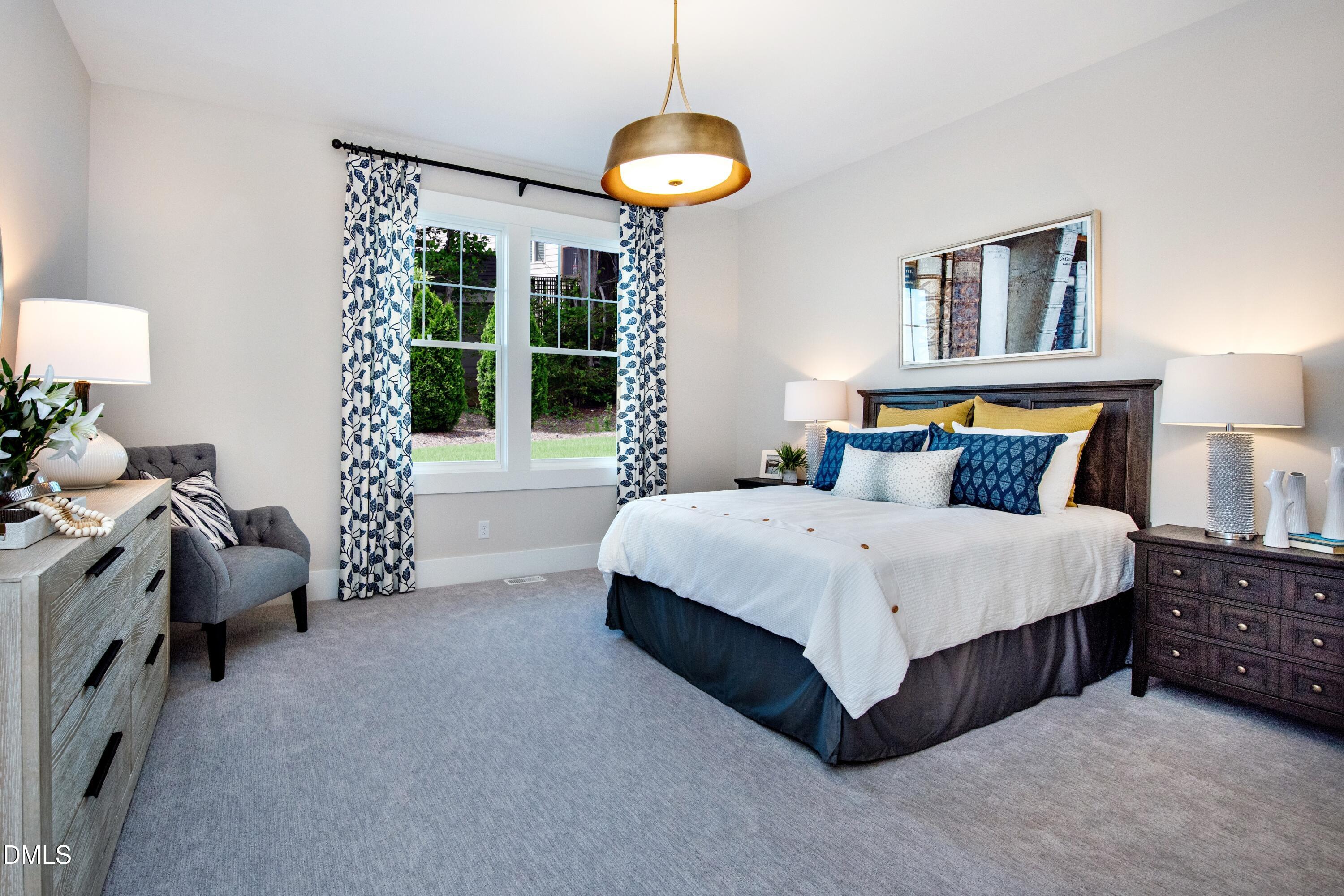 3 Wolf Tree Way Efland, NC 27243 - Photo 20 of 32 a bedroom with a bed and a window