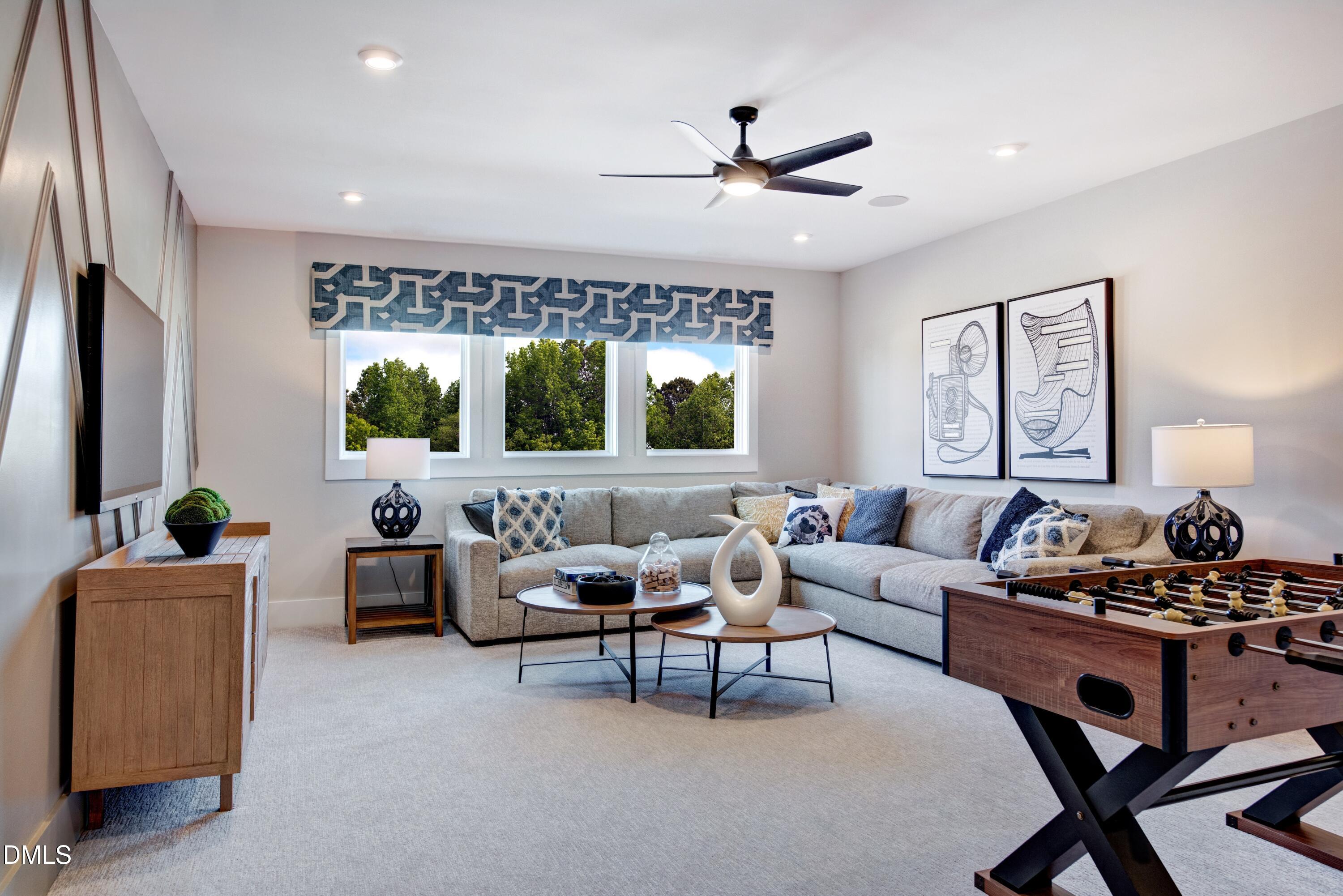 3 Wolf Tree Way Efland, NC 27243 - Photo 21 of 32 a living room with furniture and a large window