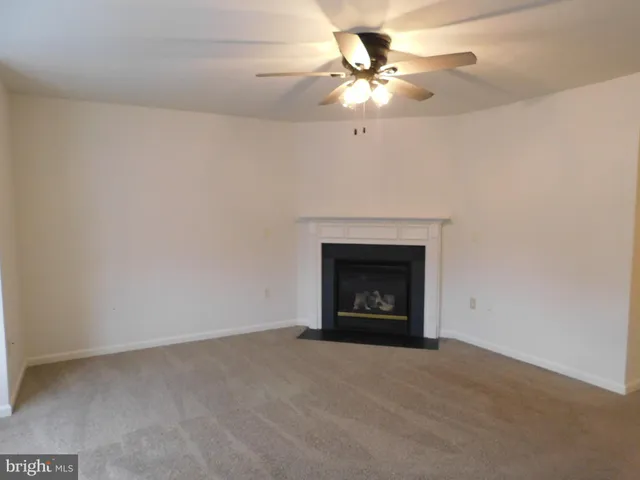 an empty room with a fireplace