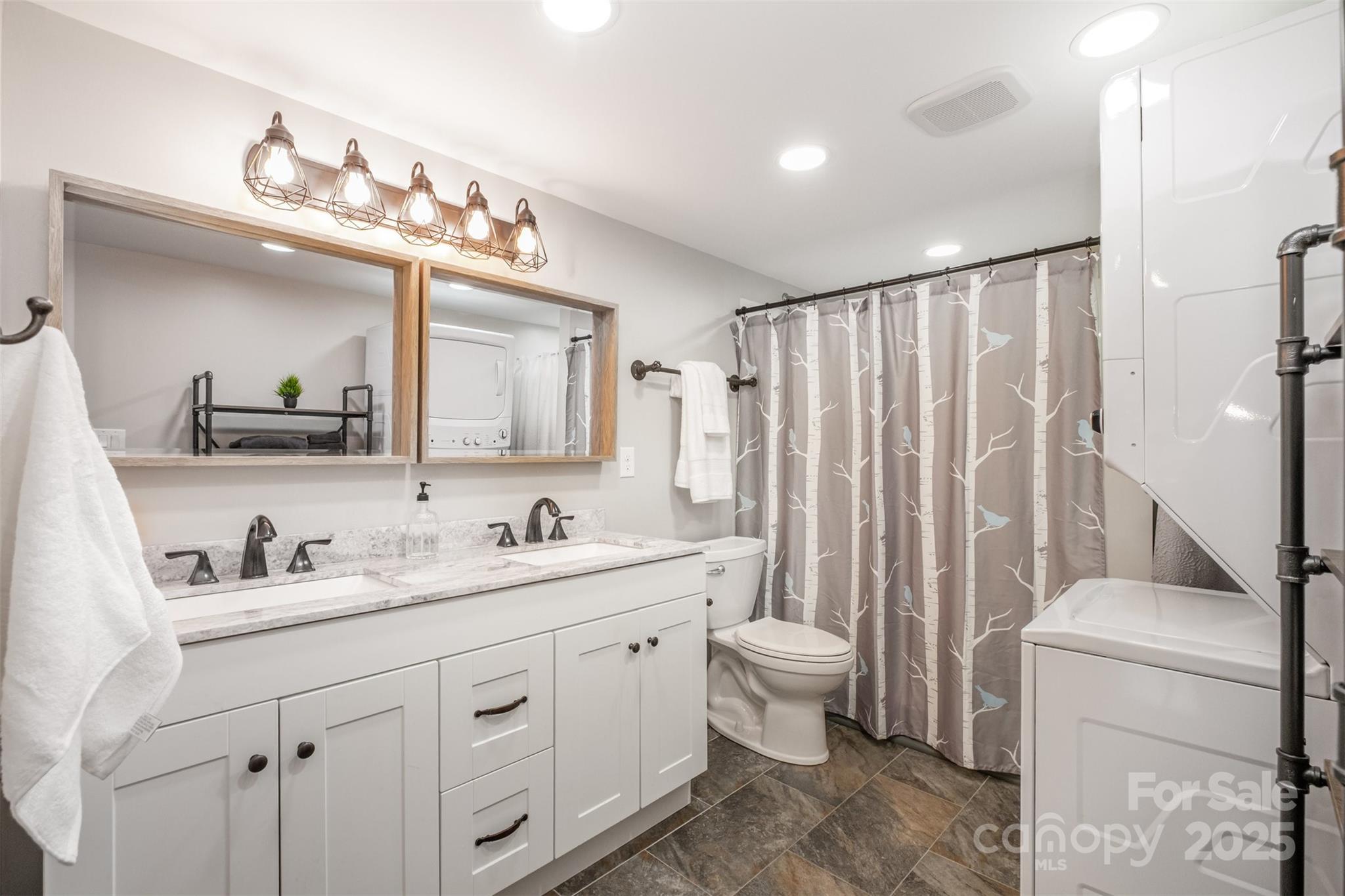 690 Hill Road Wadesboro, NC 28170 - Photo 12 of 26 a bathroom with a double vanity sink toilet and a mirror