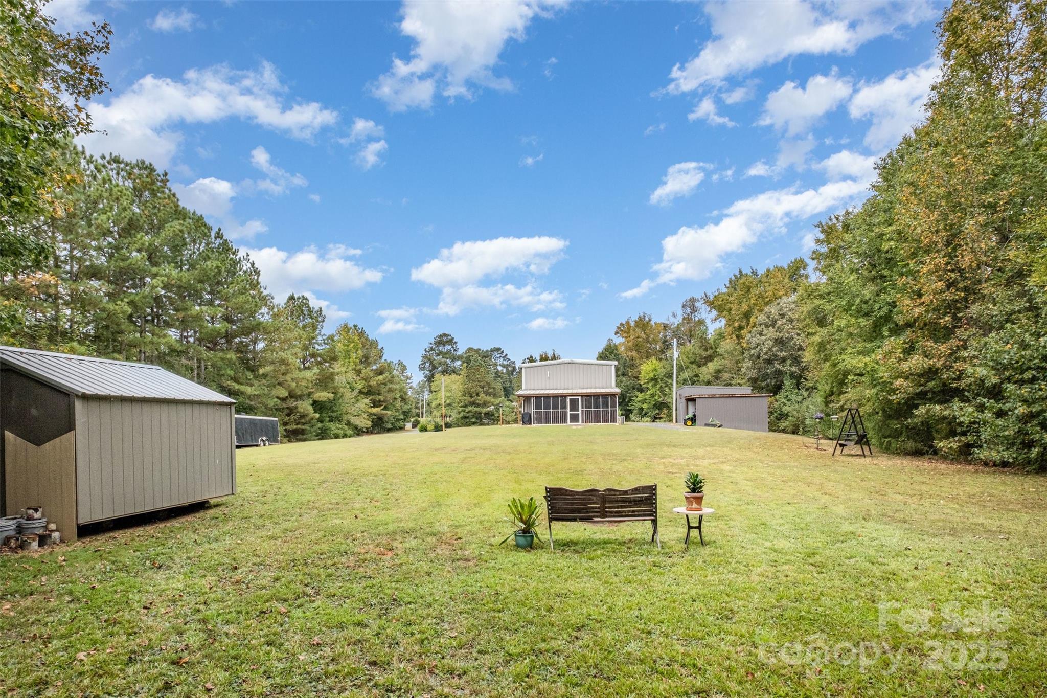 690 Hill Road Wadesboro, NC 28170 - Photo 18 of 26 a backyard of a house with table and chairs