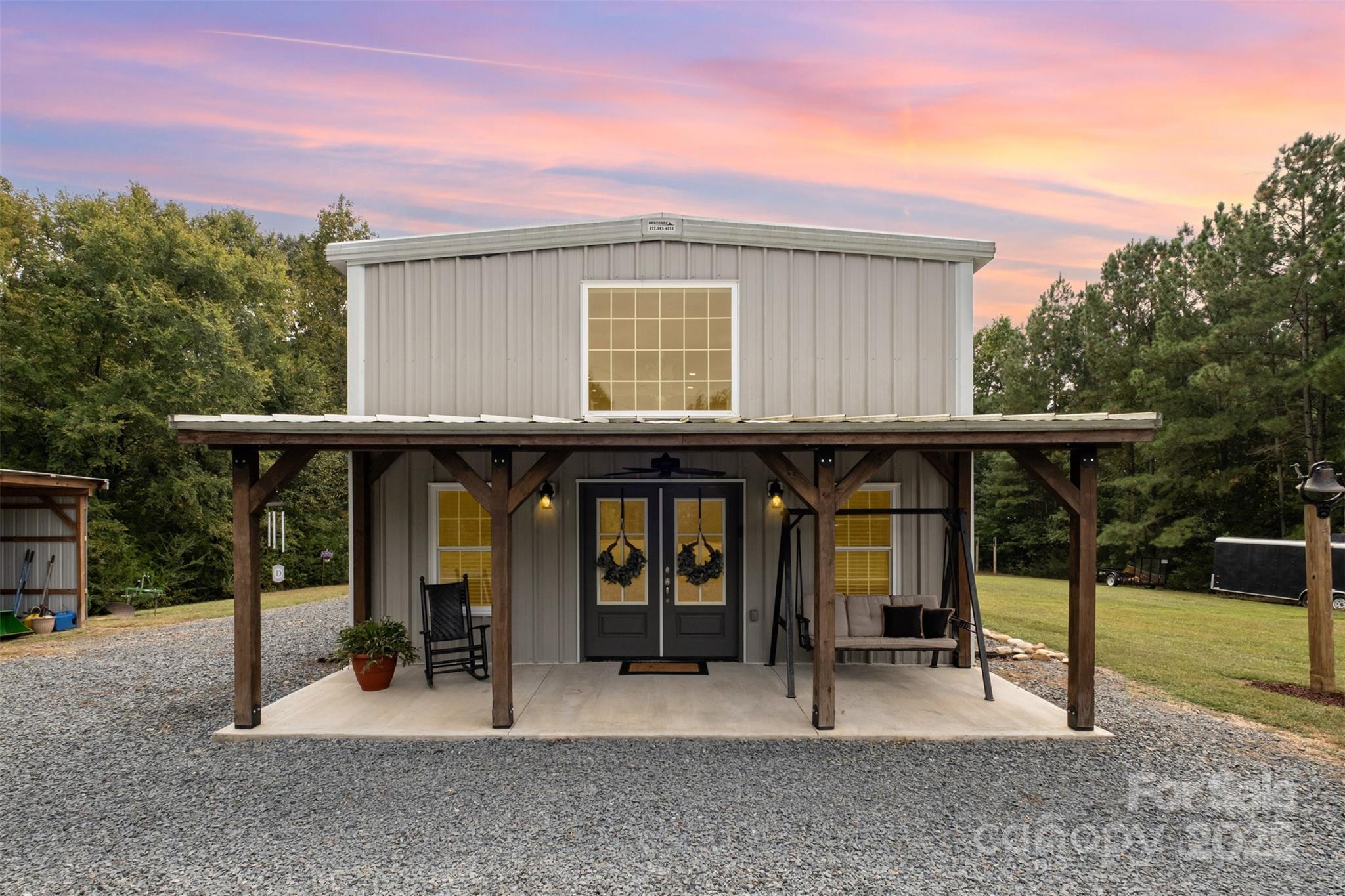 690 Hill Road Wadesboro, NC 28170 - Photo 2 of 26 a view of a chairs and table in a backyard