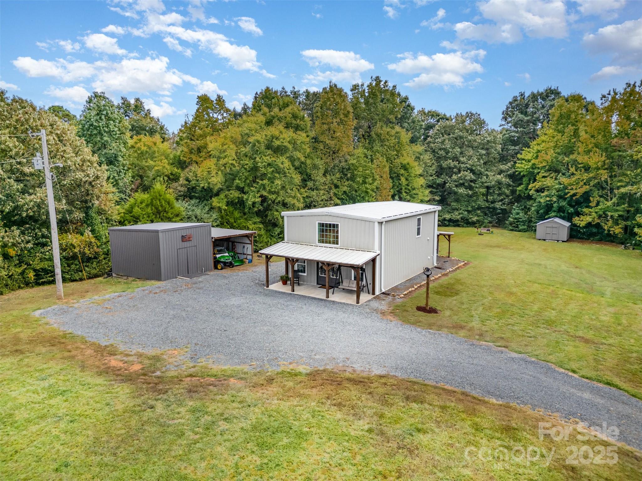 690 Hill Road Wadesboro, NC 28170 - Photo 21 of 26 a view of a house with pool and a yard