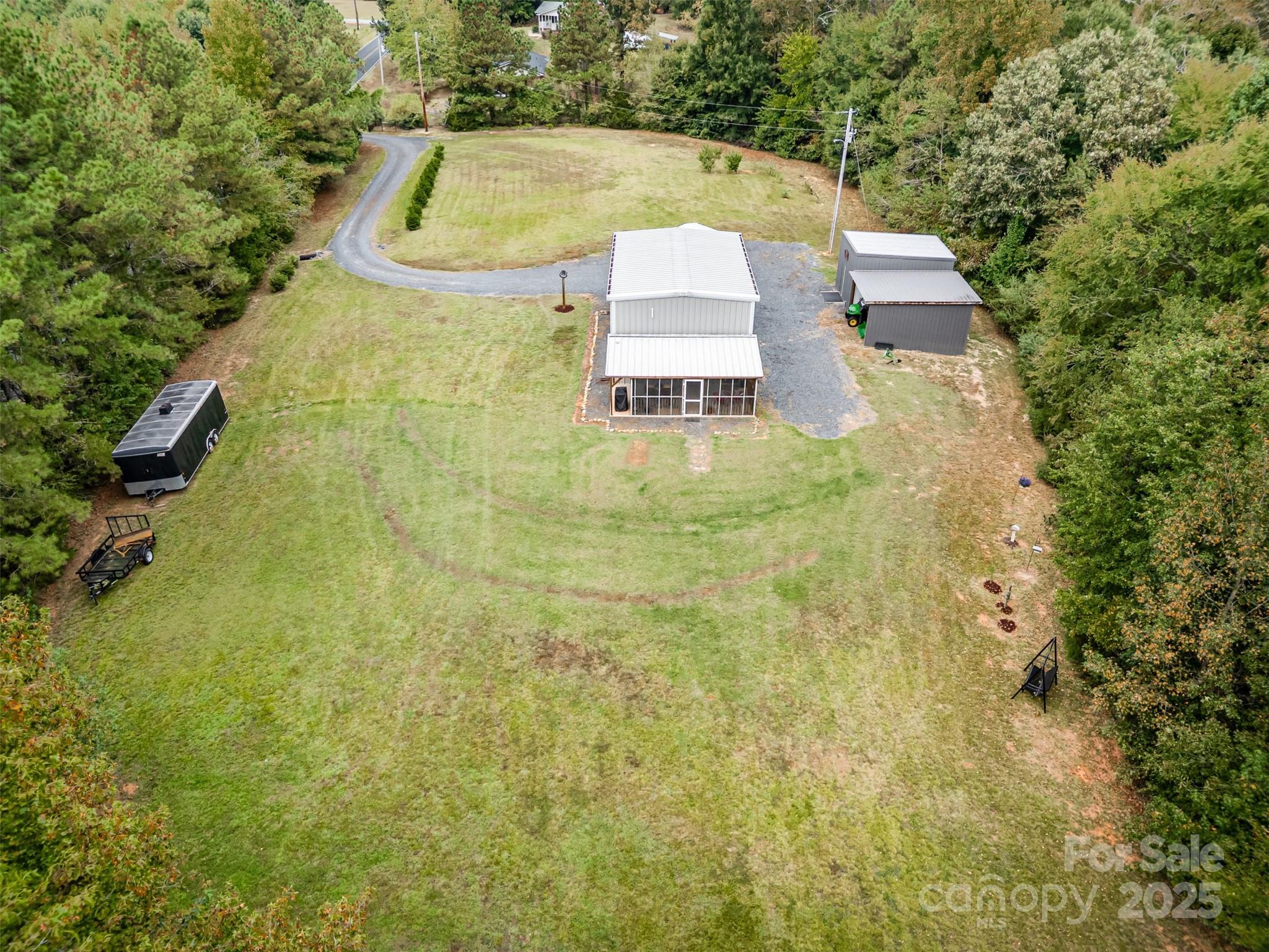 690 Hill Road Wadesboro, NC 28170 - Photo 24 of 26 a view of a swimming pool with a yard
