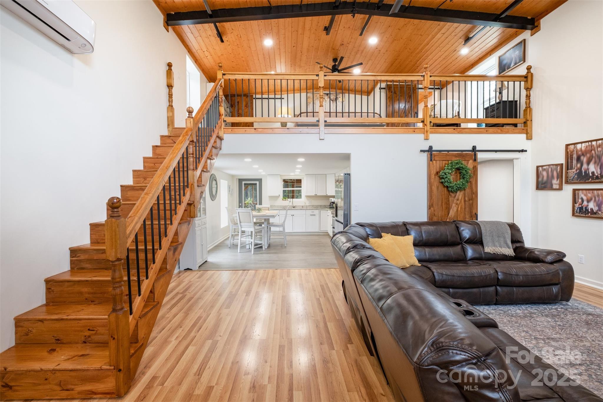 690 Hill Road Wadesboro, NC 28170 - Photo 6 of 26 a living room with furniture or stairs and a wooden floor