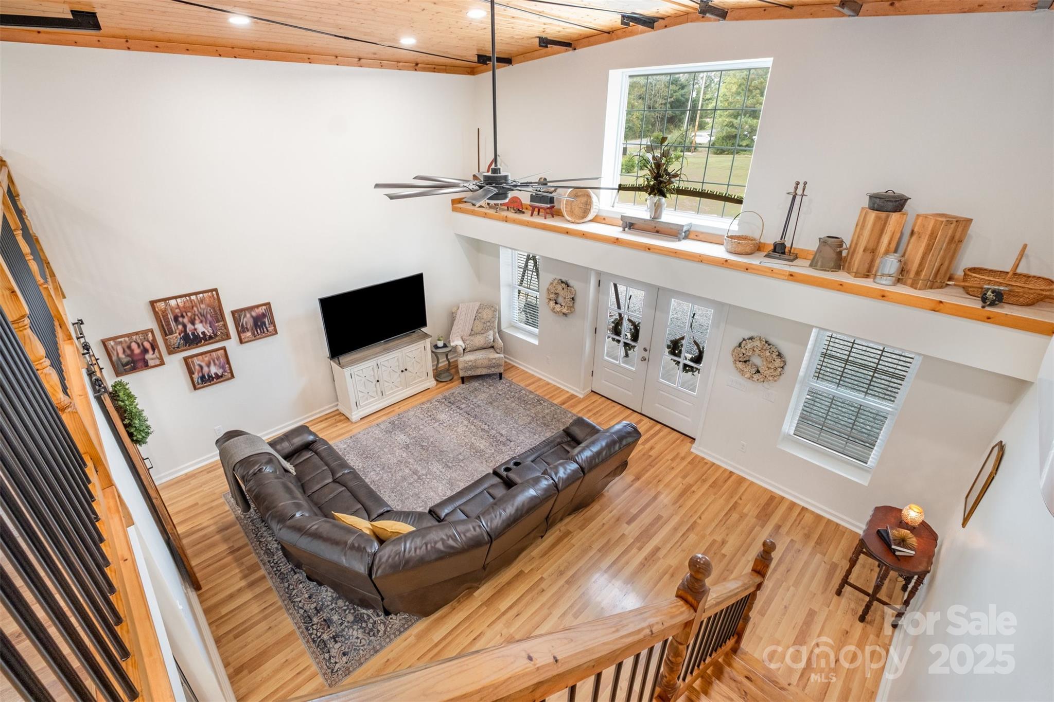690 Hill Road Wadesboro, NC 28170 - Photo 7 of 26 a living room with a bed furniture and a flat screen tv
