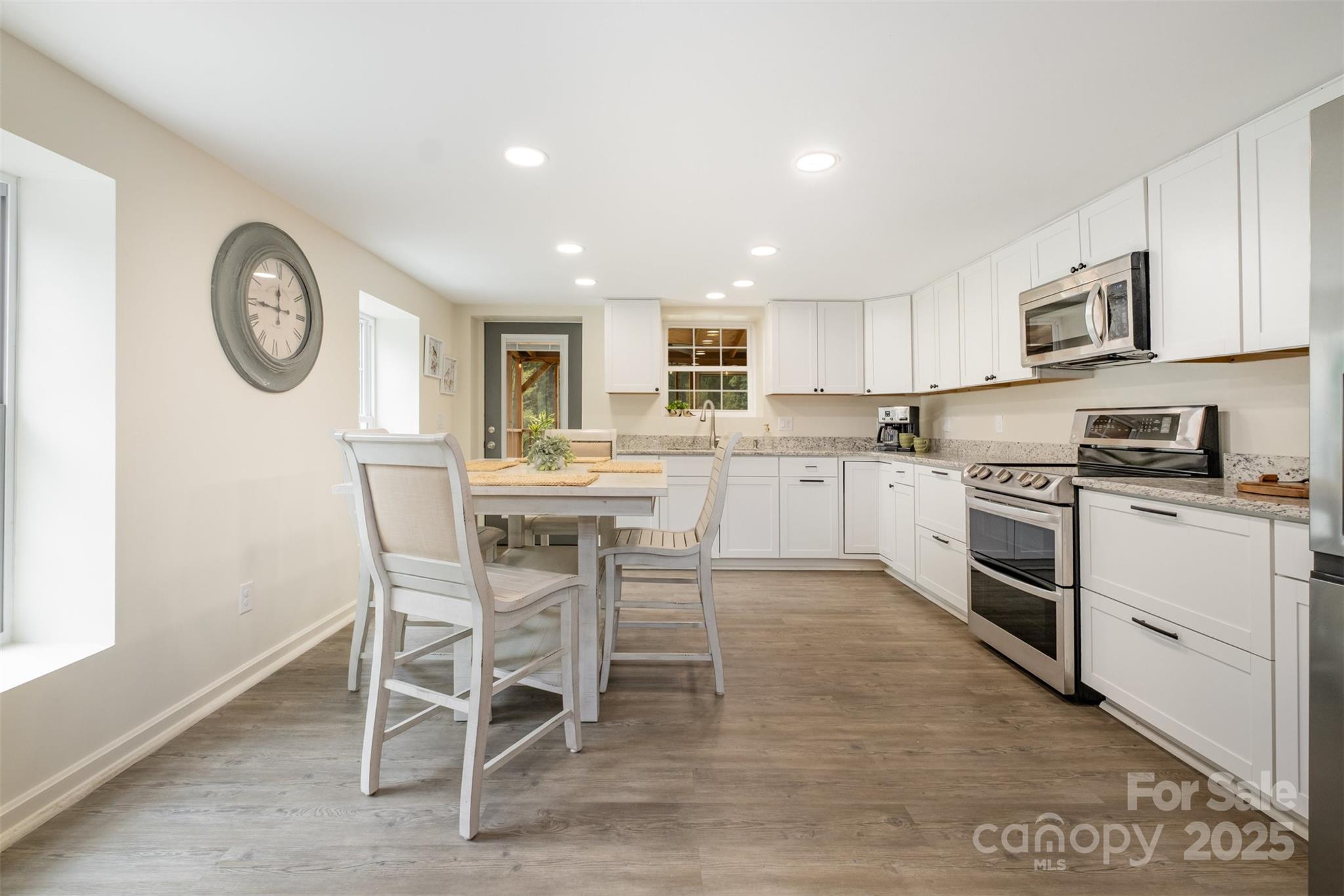 690 Hill Road Wadesboro, NC 28170 - Photo 9 of 26 a kitchen with a table and chairs in it