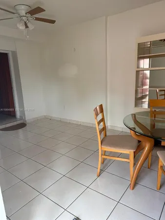 a patio with a table and chairs