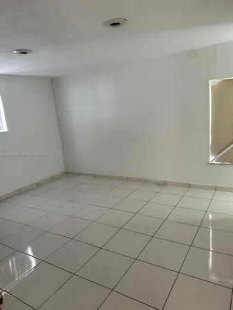 a view of a room and has window