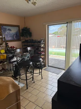 a view of a chairs and table in a room
