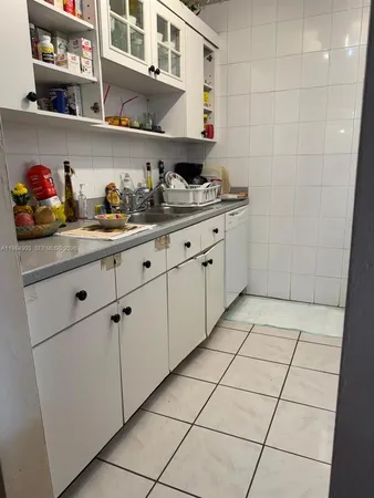 a kitchen with stainless steel appliances a cabinets and a counter top space