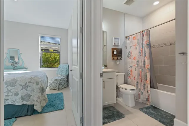 a bathroom with a toilet sink and shower