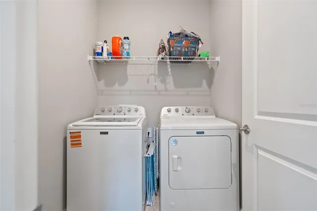 a utility room with dryer and washer