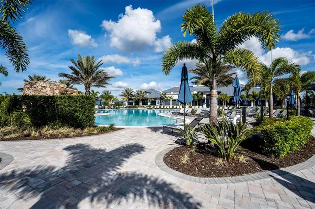a view of swimming pool with outdoor seating
